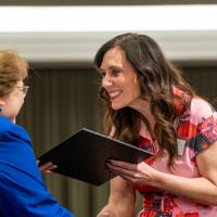 smile with awards on stage